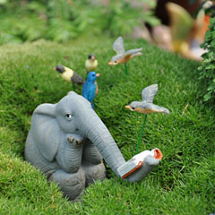 Elephant reading in the garden