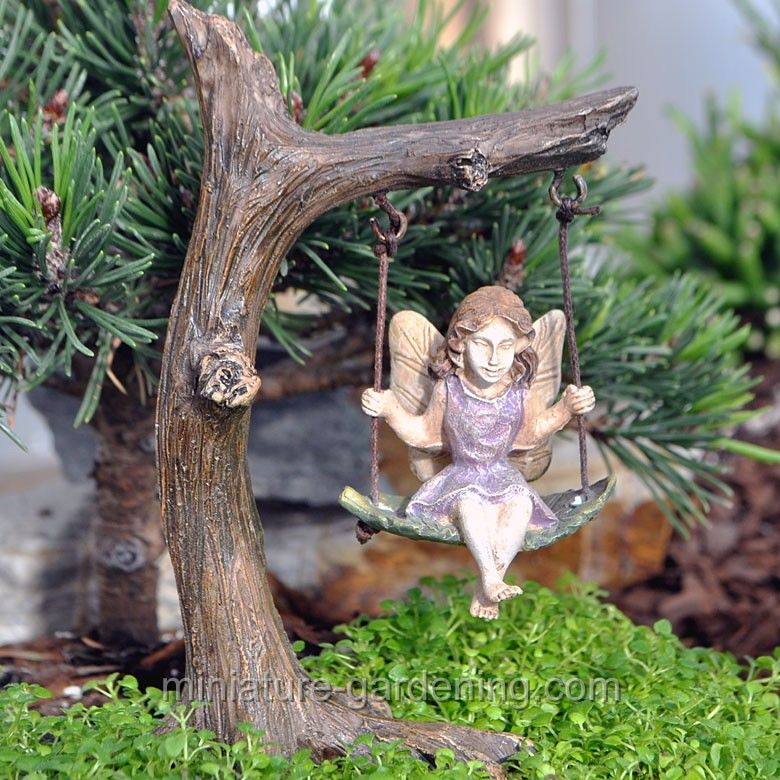 Fairy on garden swing